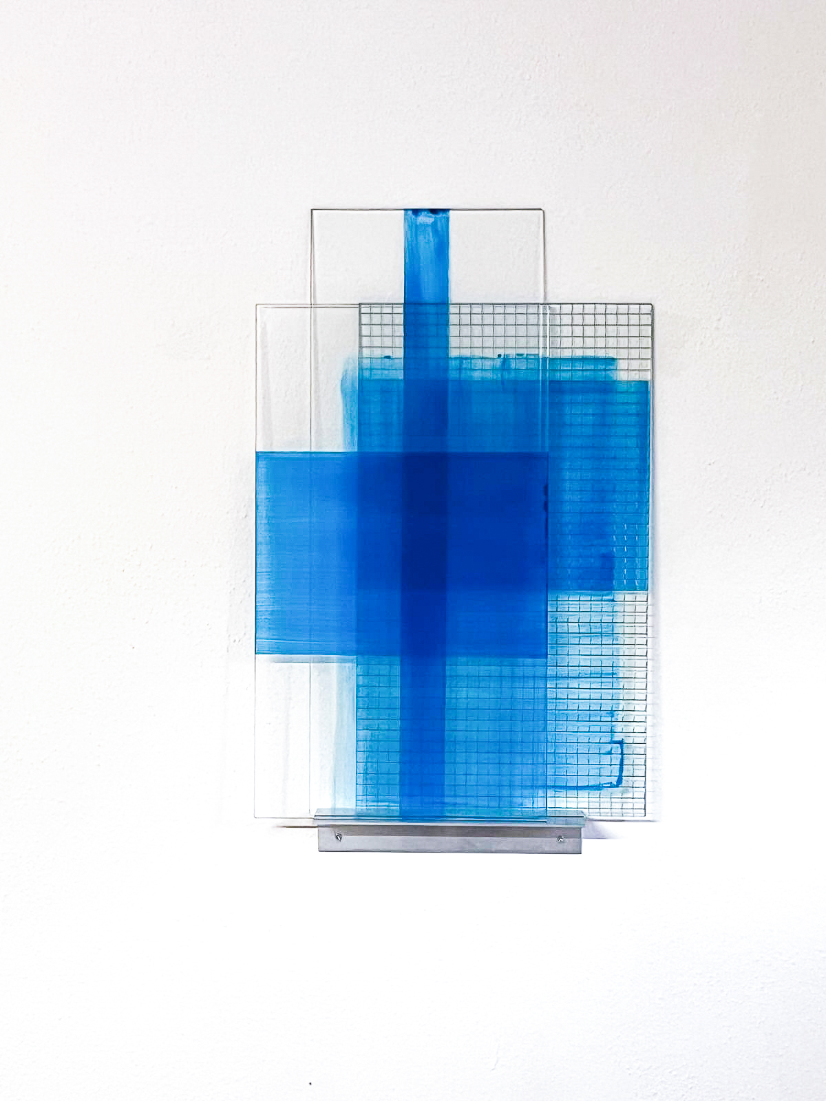 exhibition view Lech 2025, Stacked Blues, Polyurethane and enamel on glass panels (3), stacked on an aluminium shelf, 68,5 x 44,5 x 7,5 cm